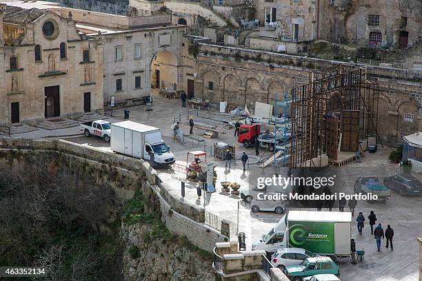 Workers placing a scaffolding in front of the church of Saints Peter and Paul on the set of the film Ben Hur being shot in Matera on January 23, 2015.