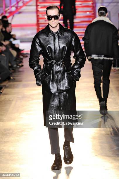 Model walks the runway at the Cerruti Autumn Winter 2014 fashion show during Paris Menswear Fashion Week on January 17, 2014 in Paris, France.