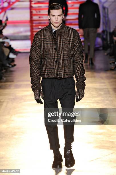 Model walks the runway at the Cerruti Autumn Winter 2014 fashion show during Paris Menswear Fashion Week on January 17, 2014 in Paris, France.