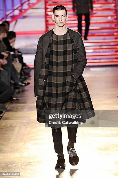 Model walks the runway at the Cerruti Autumn Winter 2014 fashion show during Paris Menswear Fashion Week on January 17, 2014 in Paris, France.