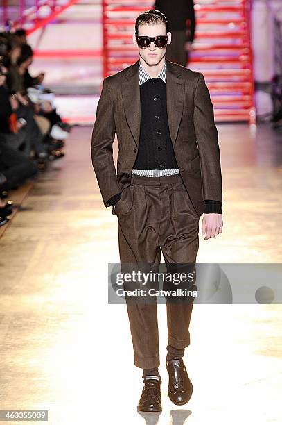 Model walks the runway at the Cerruti Autumn Winter 2014 fashion show during Paris Menswear Fashion Week on January 17, 2014 in Paris, France.