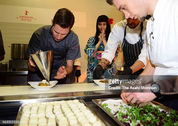 Actress Ai Hashimoto watch the kitchen of the Culinary Cinema during the 65th Berlinale International Film Festival on February 10, 2015 in Berlin,...