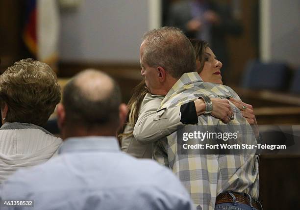 Chris Kyle's widow, Taya Kyle, hugs supporters before court is in session during the capital murder trial of former Marine Cpl. Eddie Ray Routh at...