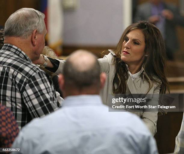 Chris Kyle's widow, Taya Kyle, hugs supporters before court is in session during the capital murder trial of former Marine Cpl. Eddie Ray Routh at...
