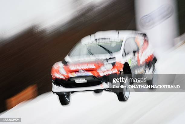 Henning Solberg of Norway and his co-driver Ilka Minor of Austria steer their Ford Fiesta WRC during the 6th stage of the Rally Sweden, second round...