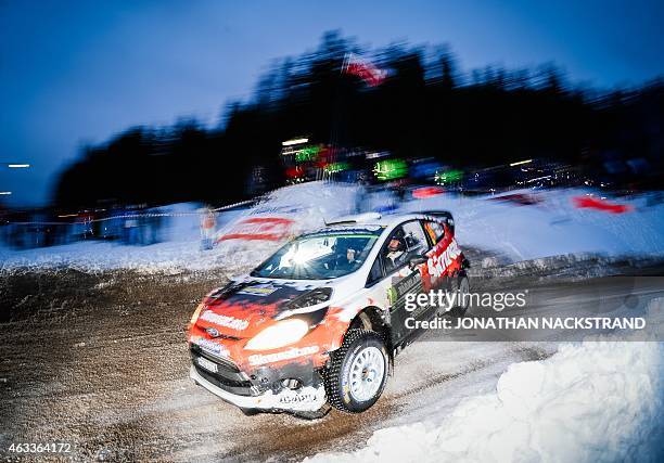 Henning Solberg of Norway and his co-driver Ilka Minor of Austria steer their Ford Fiesta WRC during the 9th stage of the Rally Sweden, second round...