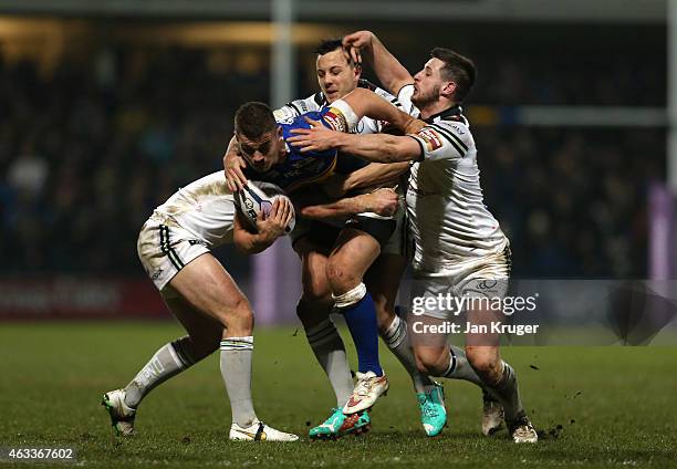 Tom Briscoe of Leeds Rhinos crashes into Cameron Phelps and Danny Craven of Widnes Vikings during the First Utility Super League match between Leeds...