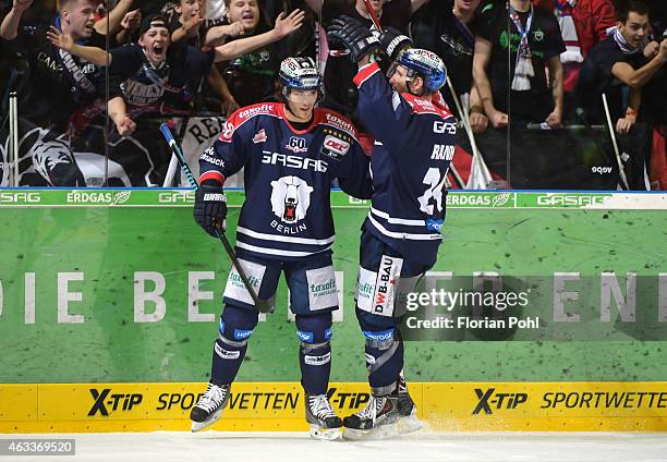 Julian Talbot and Andre Rankel of the Eisbaeren Berlin celebrate after scoring the 6:4 during the game between Eisbaeren Berlin and Augsburger...