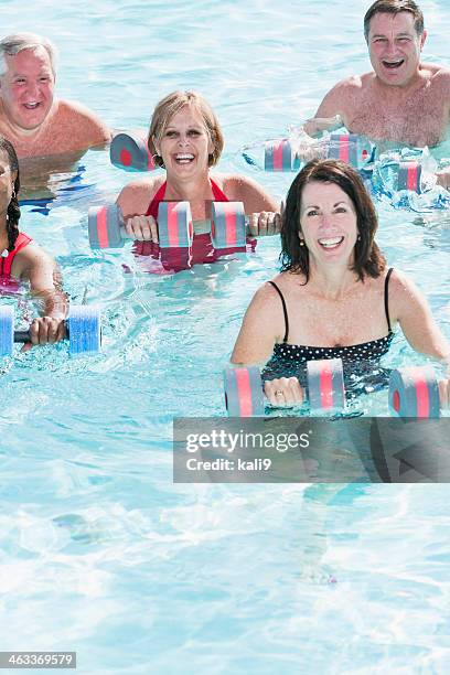 water aerobics class - aqua aerobics stock pictures, royalty-free photos & images