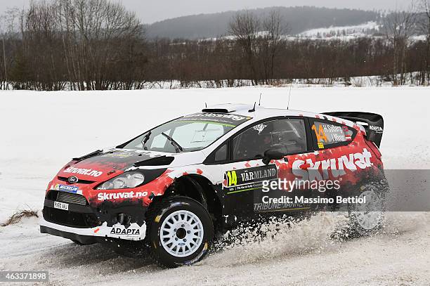 Henning Solberg of Norway and Ilka Minor of Austrian compete in their Adapta Motorsport Ford Fiesta RS WRC during Day one of the WRC Sweden on...