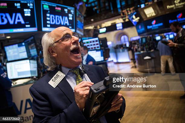Trader works on the floor of the New York Stock Exchange during the afternoon of February 13, 2015 in New York City. The Dow Jones Industrial Average...