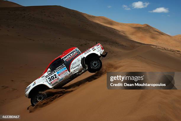 Giniel De Villiers of South Africa and Dirk Von Zitzewitz of Germany for Imperial Toyota compete in stage 12 on the way to La Serena during Day 13 of...