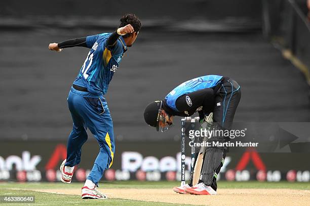 Suranga Lakmal of Sri Lanka celebrates dismissing Martin Guptill of New Zealand during the 2015 ICC Cricket World Cup match between Sri Lanka and New...