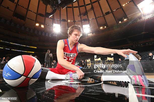 Ansel Elgort of the West Team stretches before the Sprint NBA All-Star Celebrity Game as part of 2015 All-Star Weekend at Madison Square Garden on...