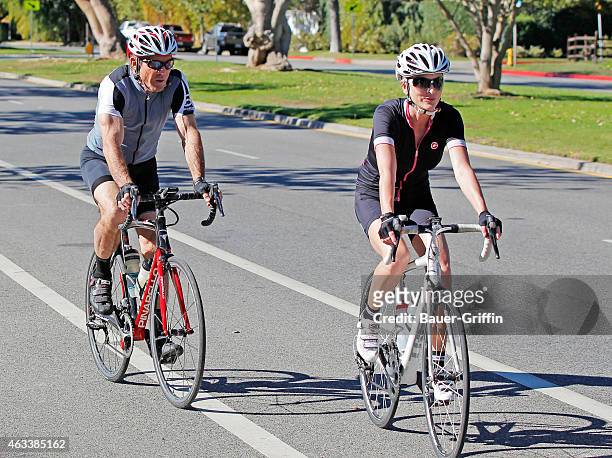 Dennis Quaid and wife Kimberly Buffington are seen cycling together on February 13, 2015 in Los Angeles, California.
