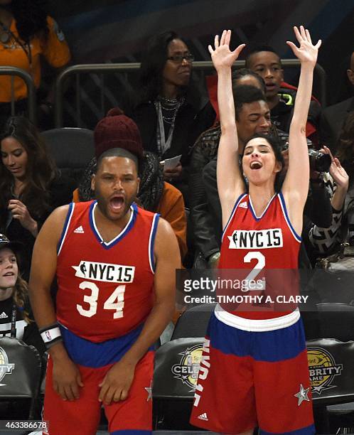Actor Anthony Anderson and comedian Sarah Silverman watch the Sprite NBA All-Star Celebrity Game at Madison Square Garden in New York February 13,...