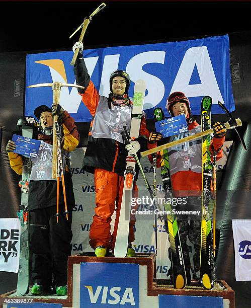 Lyman Currier of the USA, third place, Kevin Rolland of France, first place and Alex Ferreira of the USA, second place, receive their trophies after...