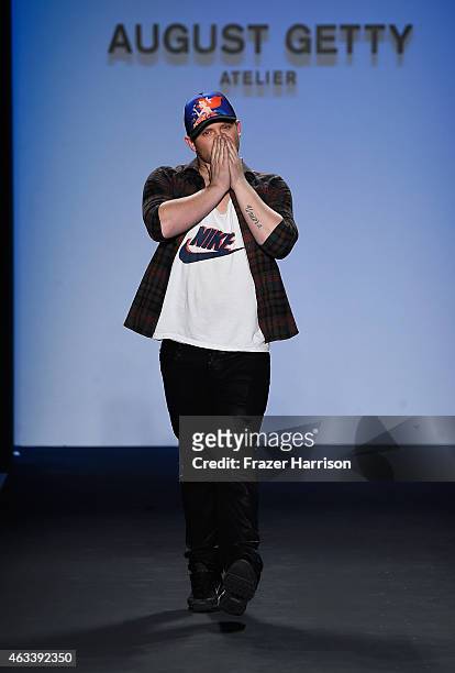 Designer August Getty poses on the runway at the August Getty fashion show during Mercedes-Benz Fashion Week Fall 2015 at The Salon at Lincoln Center...