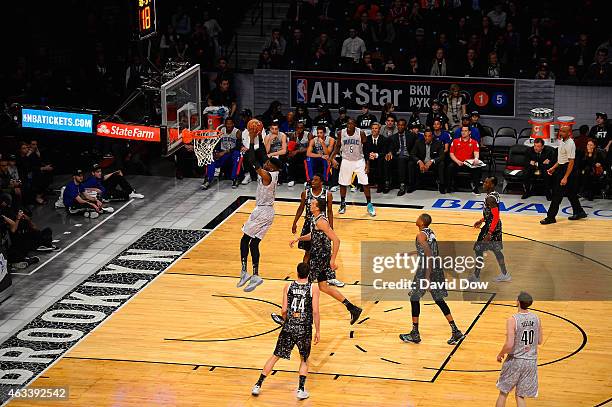 Nerlens Noel of the U.S. Team dunks against Rudy Gobert of the World Team during the BBVA Compass Rising Stars Challenge as part of 2015 All-Star...