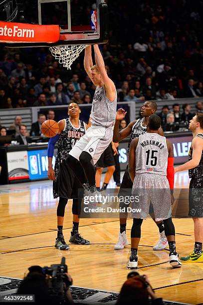 Mason Plumlee of the U.S. Team dunks against Giannis Antetokounmpo and Gorgui Dieng of the World Teamduring the BBVA Compass Rising Stars Challenge...