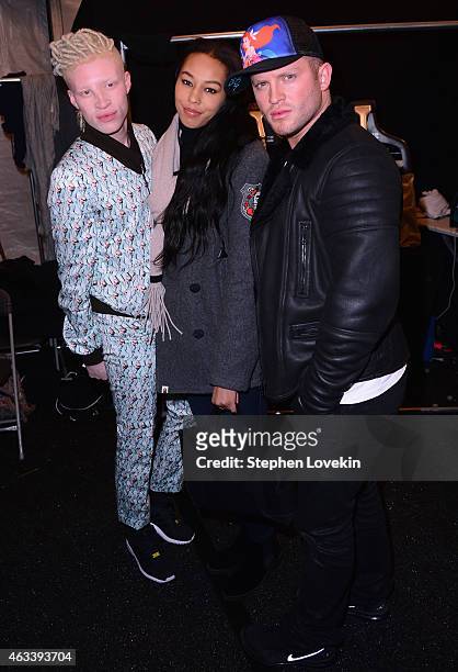 Shaun Ross, Jerzey Martin and August Getty prepare backstage at the August Getty fashion show during Mercedes-Benz Fashion Week Fall 2015 at The...