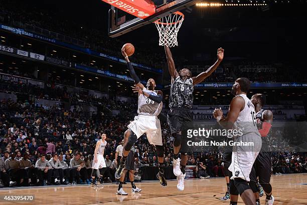 Robert Covington of the USA team shoots against Gorgui Dieng of the World team in the 2015 BBVA Rising Stars Challenge on February 13, 2015 at...
