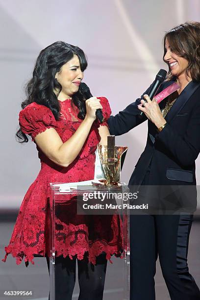 Adila Sedraia aka Indila receives from Virginie Guilhaume the revelation award for the album Mini World during the 30th 'Victoires de la Musique'...