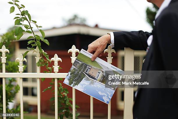 Prospective buyer looks at a property before the home auction for a four-bedroom house at 230 Blacktown Road on February 14, 2015 in Blacktown,...