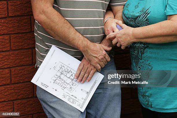 Prospective buyers wait for the start of the home auction for a four-bedroom house at 230 Blacktown Road on February 14, 2015 in Blacktown,...