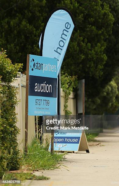 Auction signs stand on display before the home auction for a four-bedroom house at 230 Blacktown Road on February 14, 2015 in Blacktown, Australia....