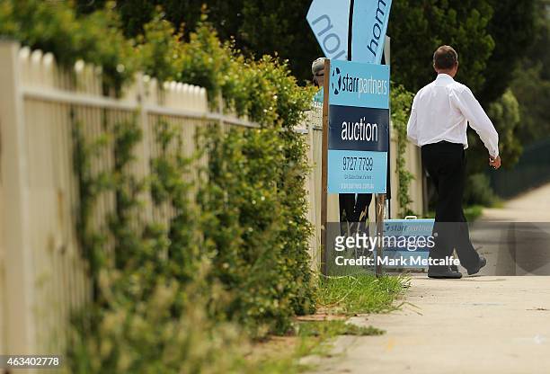 Auction signs stand on display before the home auction for a four-bedroom house at 230 Blacktown Road on February 14, 2015 in Blacktown, Australia....