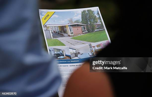 Property display leaflets are seen during the home auction for a four-bedroom house at 230 Blacktown Road on February 14, 2015 in Blacktown,...