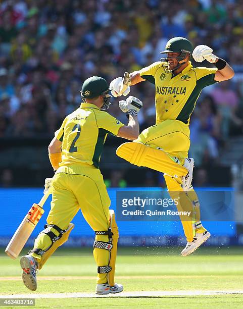 Aaron Finch of Australia celebrates after reaching his century during the 2015 ICC Cricket World Cup match between England and Australia at Melbourne...