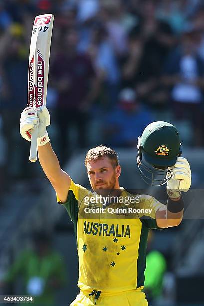 Aaron Finch of Australia celebrates after reaching his century during the 2015 ICC Cricket World Cup match between England and Australia at Melbourne...