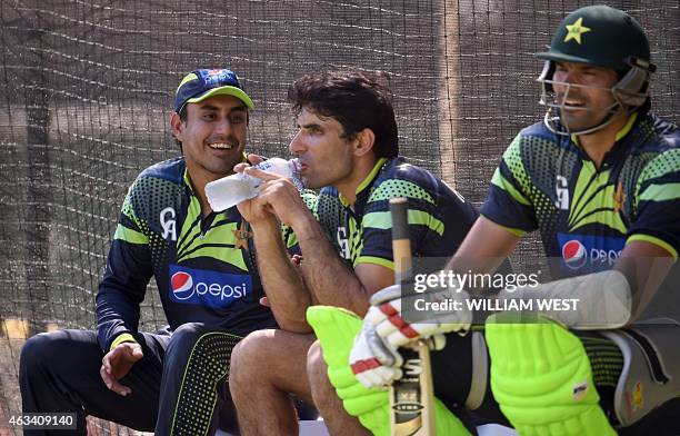 Pakistan captain Misbah-ul-Haq shares a lighter moment with teammates Nasir Jamshed and Mohammad Irfan during their final training session for the...