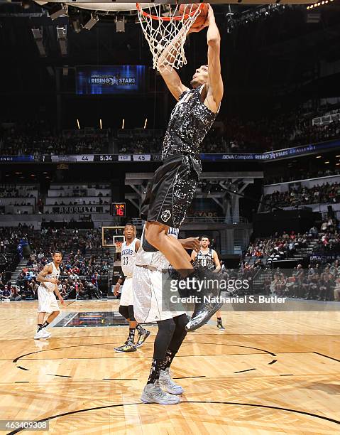 Rudy Gobert of the World Team goes up to dunk during a game against the U.S. Team during the BBVA Compass Rising Stars Challenge as part of 2015...