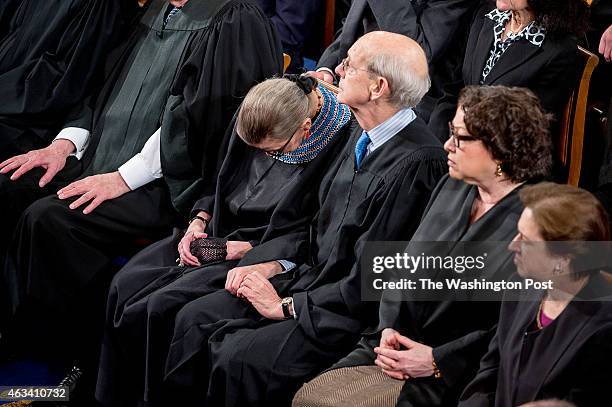 Supreme Court Justice Stephen Breyer discretely nudges Justice Ruth Bader Ginsburg to keep her awake as President Barack Obama delivers the State of...
