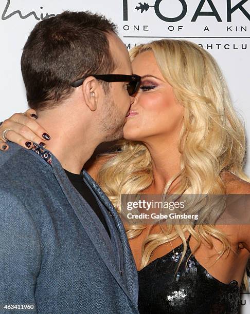 Actor/singer Donnie Wahlberg kisses his wife, actress/comedian Jenny McCarthy, as they attend a Valentine's weekend party at 1 OAK Nightclub at The...