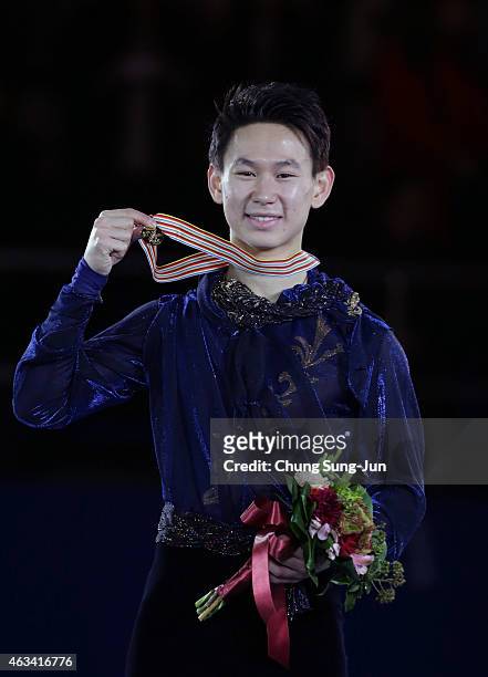 First place Denis Ten of Kazakhstan poses on the podium after the medals ceremony of the Men Skating on day three of the ISU Four Continents Figure...