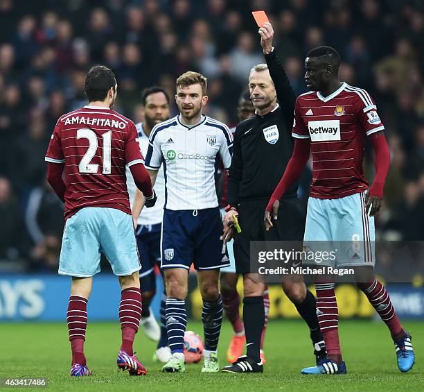 Morgan Amalfitano of West Ham United is shown a red card by referee Martin Atkinson and is sent off during the FA Cup Fifth Round match between West...