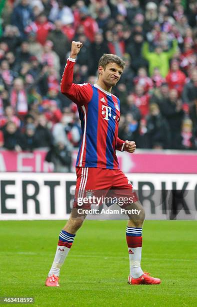 Thomas Mueller of FC Bayern celebrates after scoring a penalty goal during the Bundesliga match between FC Bayern Muenchen and Hamburger SV - at...