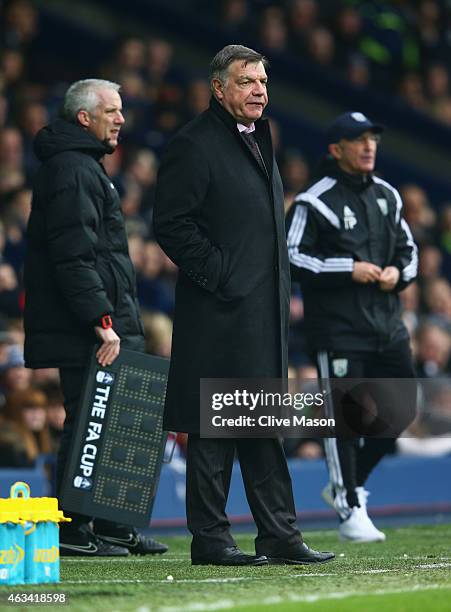 Fourth official Chris Foy, Sam Allardyce manager West Ham United and Tony Pulis manager of West Bromwich Albion look on during the FA Cup Fifth Round...