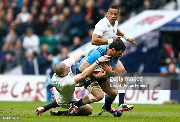 Mike Brown of England clashes with Andrea Masi of Italy during the RBS Six Nations match between England and Italy at Twickenham Stadium on February...