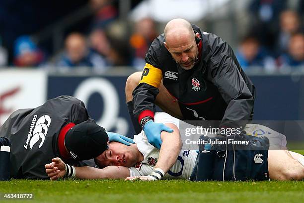 Mike Brown of England receives medical attention during the RBS Six Nations match between England and Italy at Twickenham Stadium on February 14,...