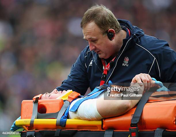 Mike Brown of England is stretchered off during the RBS Six Nations match between England and Italy at Twickenham Stadium on February 14, 2015 in...