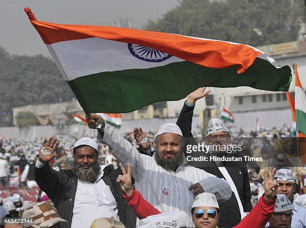 Supporters of the Aam Aadmi Party during the swearing-in ceremony of AAP leader Arvind Kejriwal at the Ramlila Ground on February 14, 2015 in New...