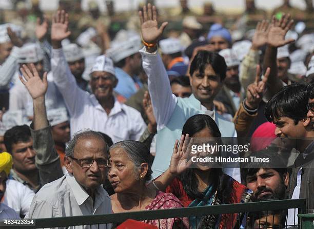 Family members of Aam Aadmi Party president Arvind Kejriwal during his swearing-in ceremony at the Ramlila Ground on February 14, 2015 in New Delhi,...