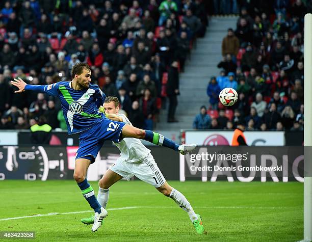 Bast Dost of VfL Wolfsburg scores the winning goal past Bernd Leno of Bayer Leverkusen during the Bundesliga match between Bayer 04 Leverkusen and...