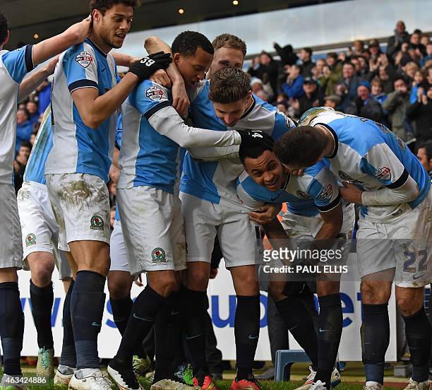 Blackburn's Norwegian striker Joshua King celebrates with teammates after scoring their third goal during the English FA Cup fifth round football...