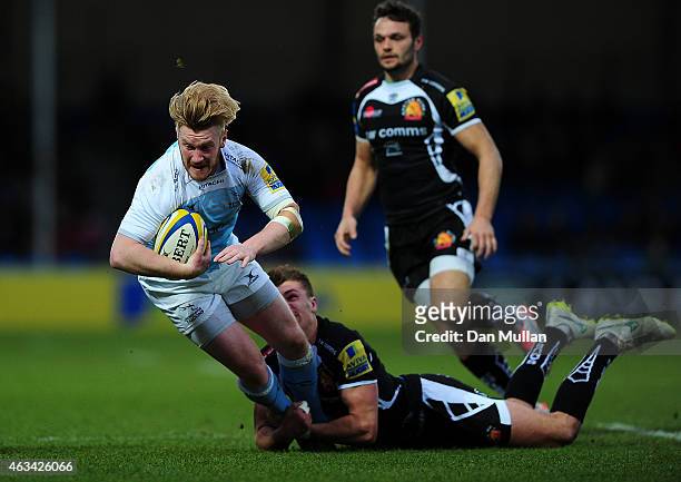 Tom Catterick of Newcastle Falcons is tackled by Henry Slade of Exeter Chiefs during the Aviva Premiership match between Exeter Chiefs and Newcastle...